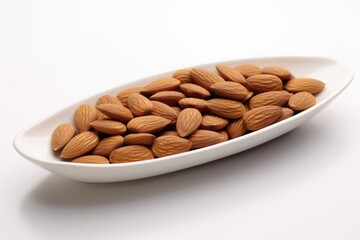 A white bowl filled with almonds on top of a table.