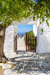 Gate at the entrance of Panaghia Church, Folegandros. Cyclades of Greece. - 695912164