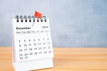 December 2024 calendar and red push pin.