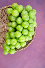 Sweet Green Shine Muscat grape in Bamboo basket.