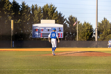 Baseball Pitcher Walking to the Pitchers Mound a the Start of the Game