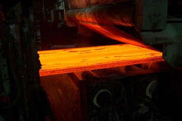 Hot Steel Slabs issuing from a continuous casting machine (CCM) 
