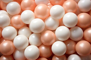 a lot of white and peach fuzz color plastic balls for kid