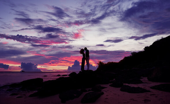 Romantic silhouette of a loving couple on honeymoon