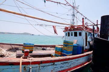 Fototapeta na wymiar Traditional fishing boat for crab catching moored at wharf in Phuket, Thailand.