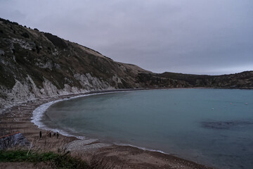 Lulworth Cove and beach view at winter day. Lulworth Cove bay, beach and cliffs view . The Jurassic Coast is a World Heritage Site on the English Channel coast of southern England. Dorset, UK. public 