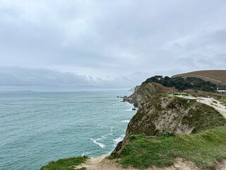 Jurassic coast view in Dorset at winter time. Cold winter day. Lulworth Cove cliffs view on a way to Durdle Door. The Jurassic Coast is a World Heritage Site on the English Channel coast of southern E
