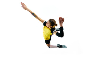 Top view. Dynamic image of young woman, volleyball player during game, hitting ball in a jump...