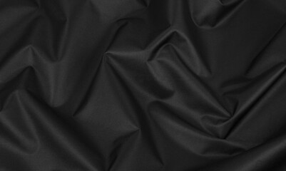Background of crumpled black fabric