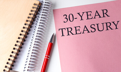30-YEAR TREASURY word on the pink paper with office tools on white background