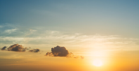 Sunset sky clouds in the evening with orange sunlight golden hour, Horizon sky majestic 