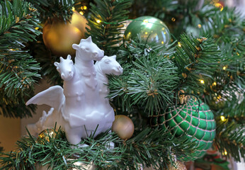 Three-headed dragon near the Christmas tree. Symbol of the year according to the eastern calendar.