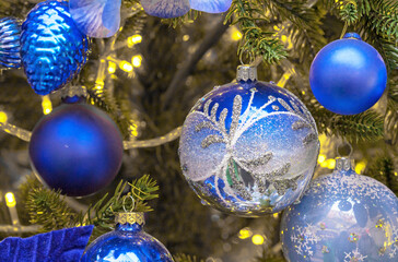 Dark blue Christmas balls on Christmas tree. Christmas and New Year's decor.