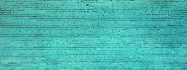 The texture of the brick wall of many rows of bricks painted in cyan color