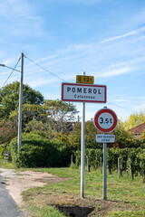 City road sign in Pomerol village, production of red Bordeaux wine, Merlot or Cabernet Sauvignon grapes on cru class vineyards in Pomerol, Saint-Emilion wine making region, France, Bordeaux