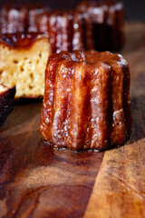 Canele, French pastry flavored with rum and vanilla, soft and tender custard center and  dark,...