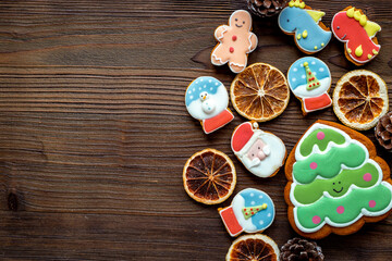 Christmas cookies in the shape of a dragon, Santa and Christmas tree. Happy New Year background