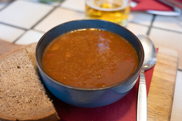 German food, thick, rich goulash meat soup served hot in bowl in old German cafe in countryside