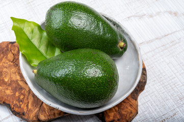 Green ripe avocado fruits from organic avocado plantation - healthy food