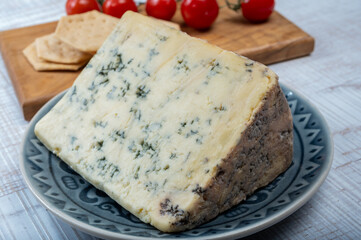 Cheese collection, English semi-soft, crumbly old stilton blue cheese close up