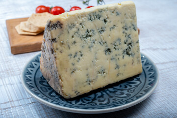 Cheese collection, English semi-soft, crumbly old stilton blue cheese close up