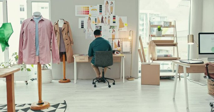 Fashion designer, creative office desk and planning for ideas, production and moodboard wall for startup inspiration. Business man, tailor or artist with sketch, color palette and clothes or textile