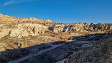 Fototapeta na wymiar Nature's Tapestry: Cappadocia's rugged terrain, a testament to time and tumultuous tales.