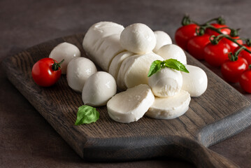 Mozzarella cheese close-up on a dark background. Side view, selective focus.