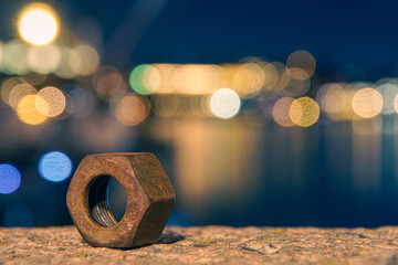 View of a old rusty nut at night