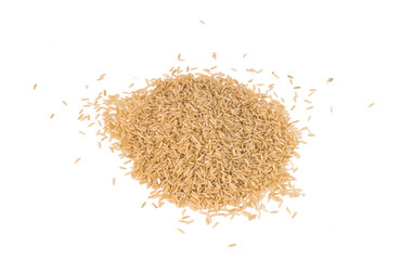 Brown rice lies on an isolated background