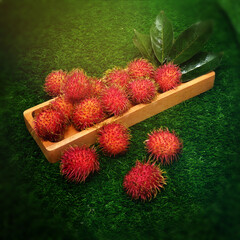 Fresh rambutans indonesian fruit on the grass