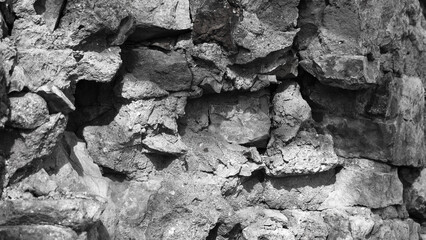 old gray stone wall closeup