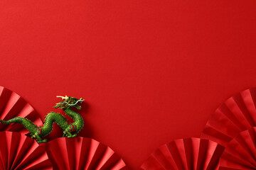 Chinese New Year 2024 banner template with folding paper fan and dragon on red background.