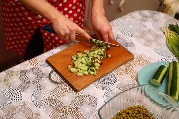 Cucumber cutting on the kitchen
