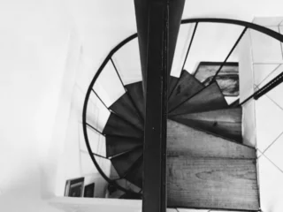 Fotobehang Trappen spirals down  © Kaila