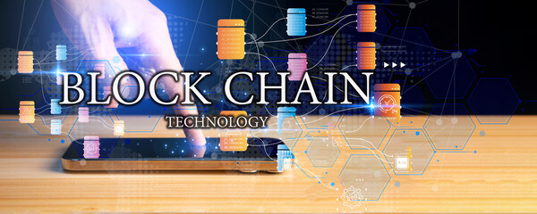 Blockchain technology and network concept. Businessman holding text blockchain in hand with icons network connection on blue security and digital connection background
