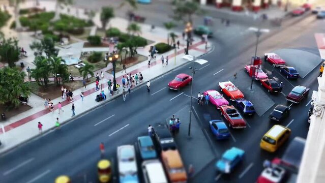 Time lapse from high angle view of Central Park in Havana downtown, Paseo de Mart&iacute; street, Cuba, with crowd of people and the traffic car with tilt shift effect	