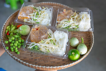 Fish curry sauce eat with Rice noodles and vegetables. Spicy taste, Thai food.	