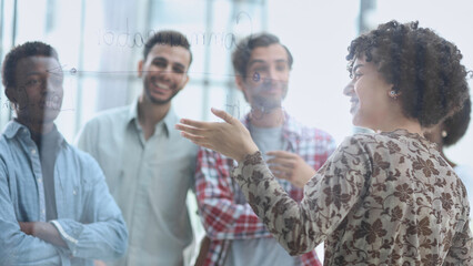 Young, motivated and experienced employees are brainstorming in the conference room.