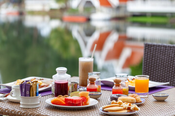 Lavish breakfast spread at luxury resort with scenic view. Travel and gastronomy.