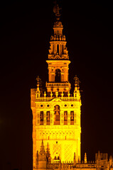 The Giralda illuminated at night. Seville. Andalusia. Spain.