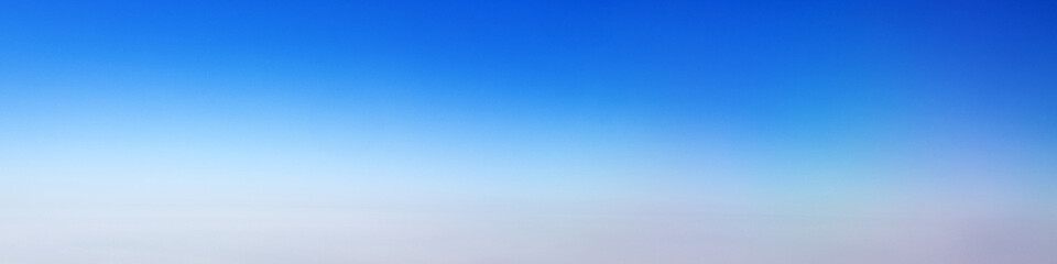 The banner blue sky gradient. A clear sunset sky turning into a bright blue. Copy space