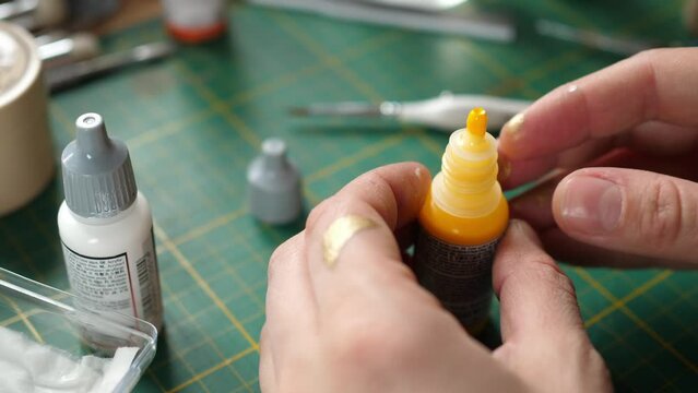 throwing a metal mixing ball into the paint bottle, miniatures for rpg game