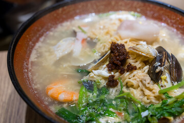 Seafood noodles soup bowl in restaurant
