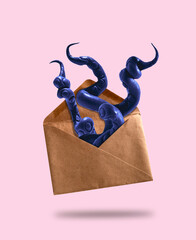 Purple octopus tentacles stick out of vintage envelope. Humor postcard about mail services.