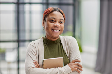 Close-up photo of a pretty, pensive dark-skinned girl, student, manager, secretary, freelancer