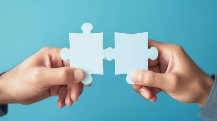 Foto op Plexiglas Jigsaw puzzle pieces forming the last connection, symbolizing the completion of a challenging task and the satisfaction of solving a problem together © Rabbi