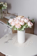 Pink artificial flowers. Flowers for the dining table