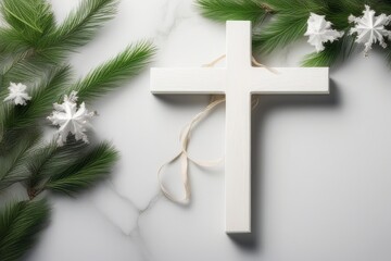 white cross, pine branches, white pinecones, and golden stars on marble.
