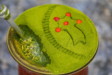 Traditional Brazilian chimarrão prepared with yerba mate (Ilex paraguariensis) decorated with a...